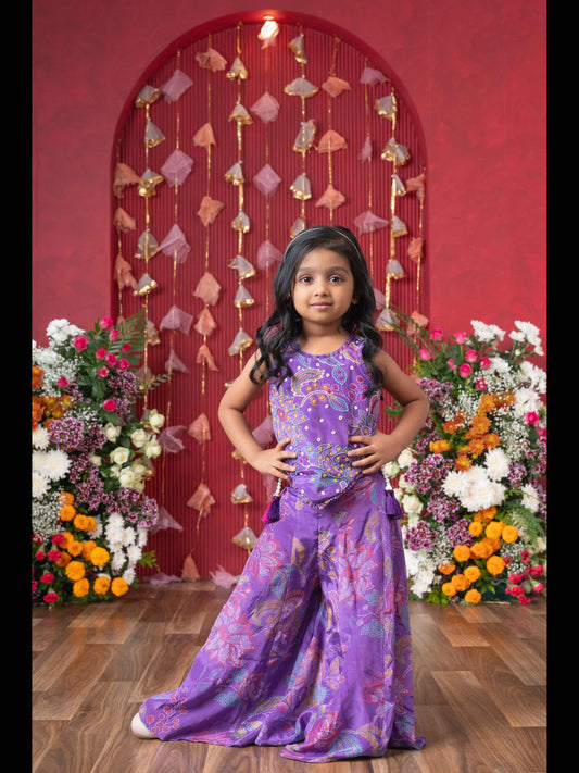 Add A Pop Of Color To Your Celebrations With This Vibrant Purple Printed Top And Flared Palazzo Set