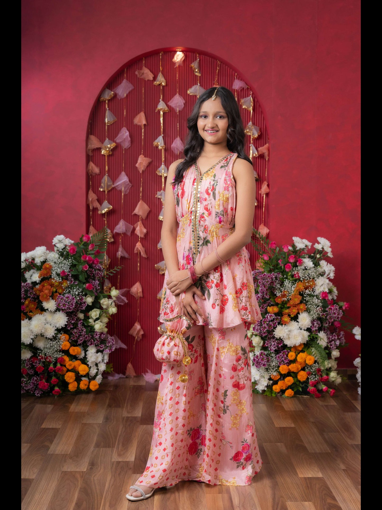 Floral Elegance: A Chic Peplum Set With Matching Potli For Festive Charm