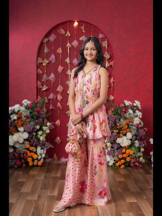 Floral Elegance: A Chic Peplum Set With Matching Potli For Festive Charm