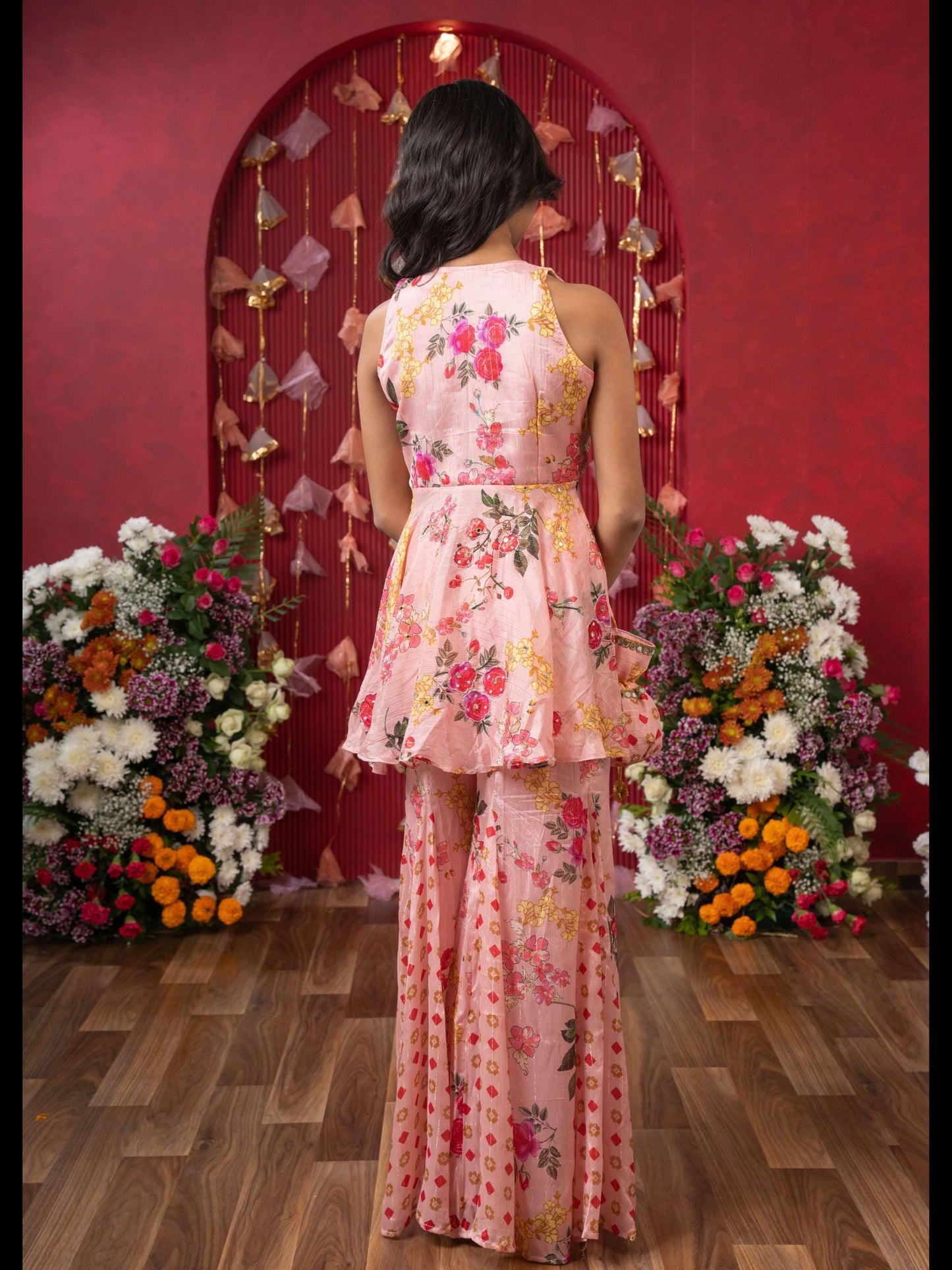 Floral Elegance: A Chic Peplum Set With Matching Potli For Festive Charm