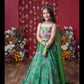 Grace Your Festivities With This Vibrant Green Lehenga Set, Featuring Floral Embroidery And A Flowy Printed Skirt