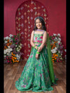 Grace Your Festivities With This Vibrant Green Lehenga Set, Featuring Floral Embroidery And A Flowy Printed Skirt