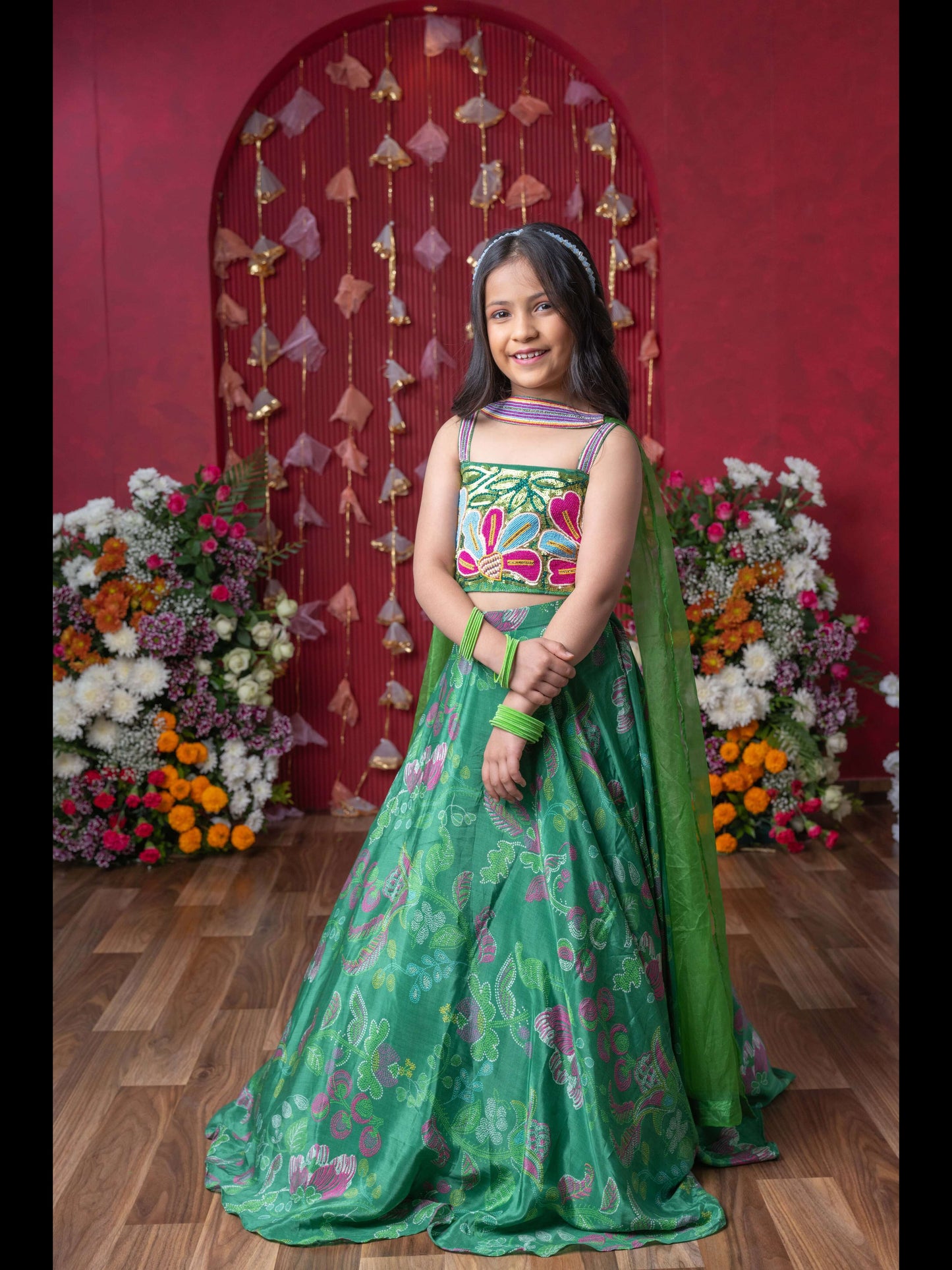 Grace Your Festivities With This Vibrant Green Lehenga Set, Featuring Floral Embroidery And A Flowy Printed Skirt